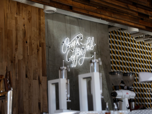 Wall inside of Onyx Coffee with neon lights