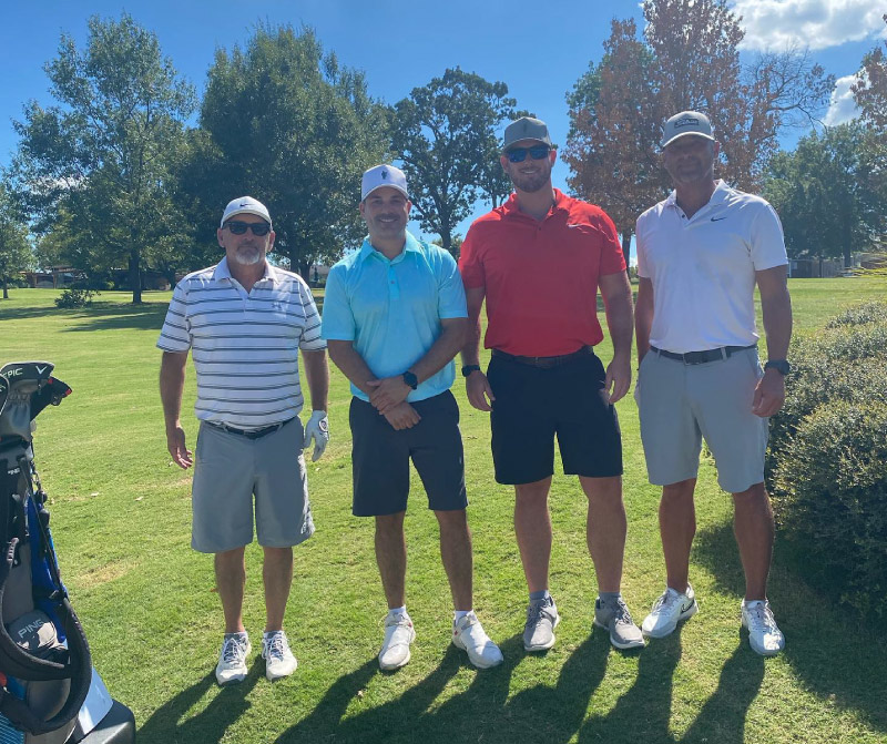 Lindsey team posing in the 2022 Nolan Richardson Golf Tournament
