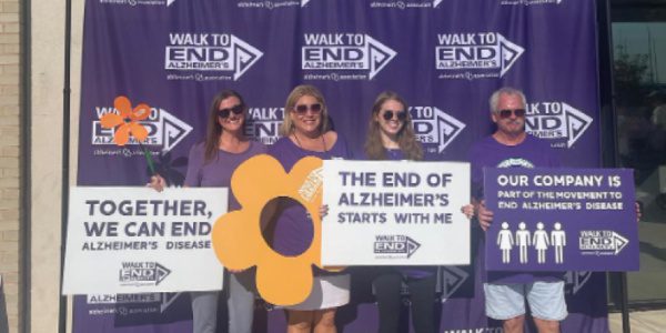Lindsey team holding signs at the 2022 Walk to End Alzheimers
