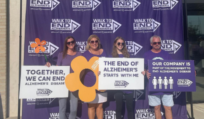 Lindsey team holding signs at the 2022 Walk to End Alzheimers